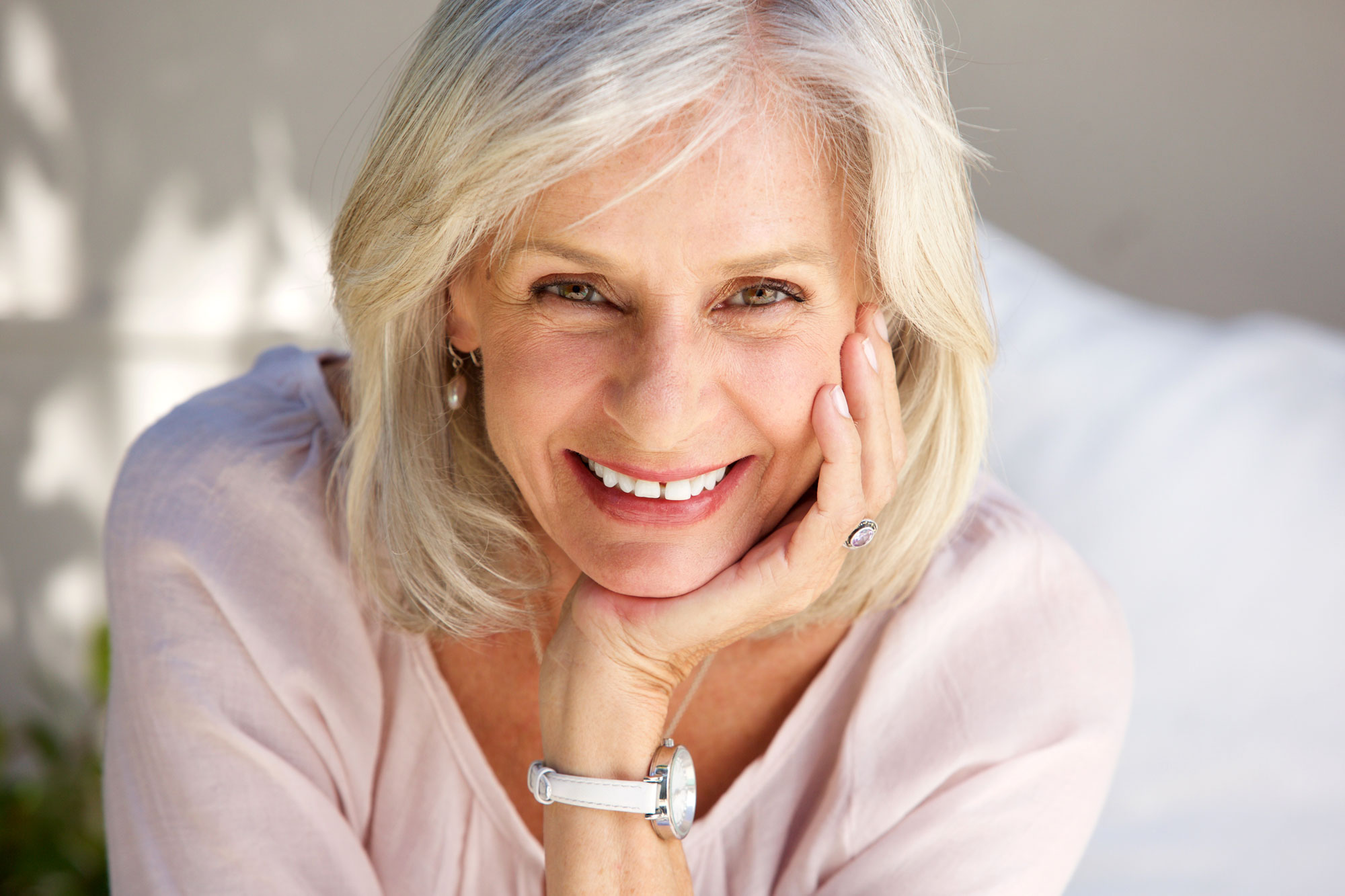 Portrait Of Smiling Grey Haired Mature Woman Looking