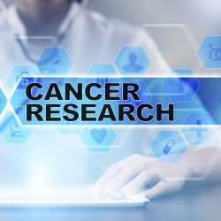 A doctor's torso behind the words Cancer Research with a blue background.