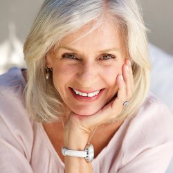 Close-up of an attractive older woman's smiling face.